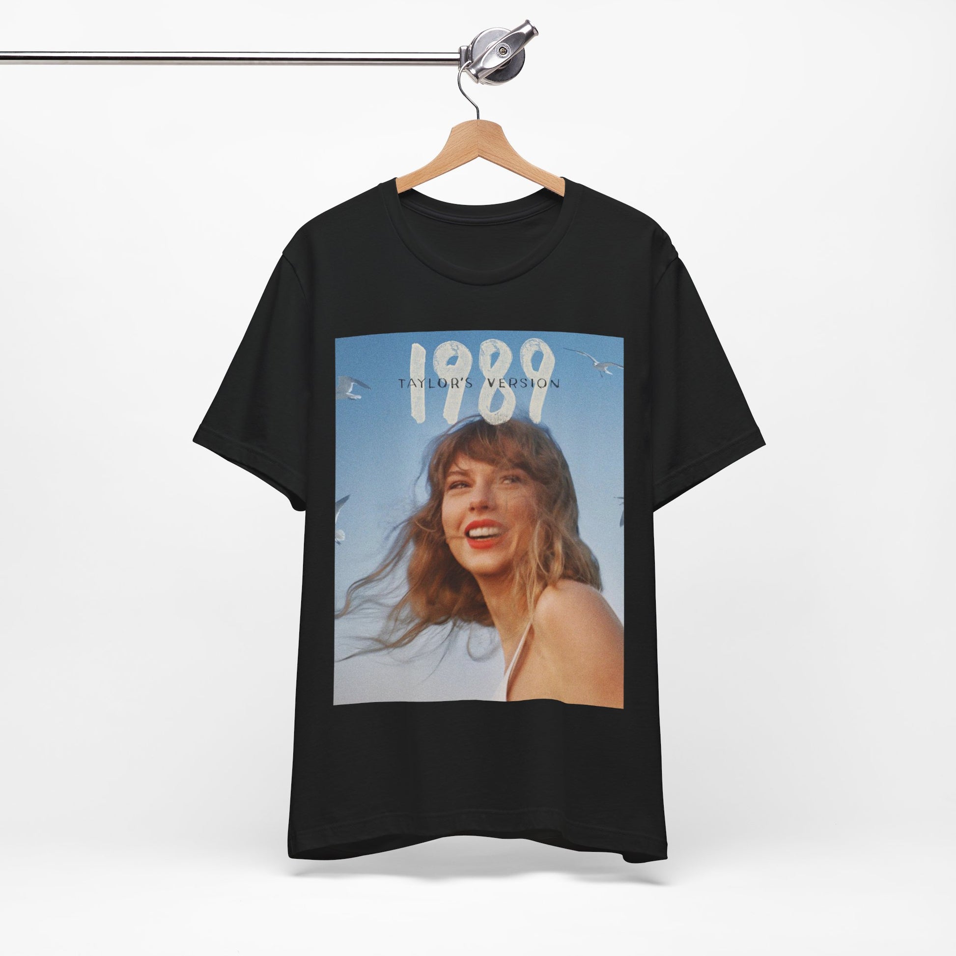 A black graphic t-shirt featuring a graphic related to Taylor Swift's 1989 album.