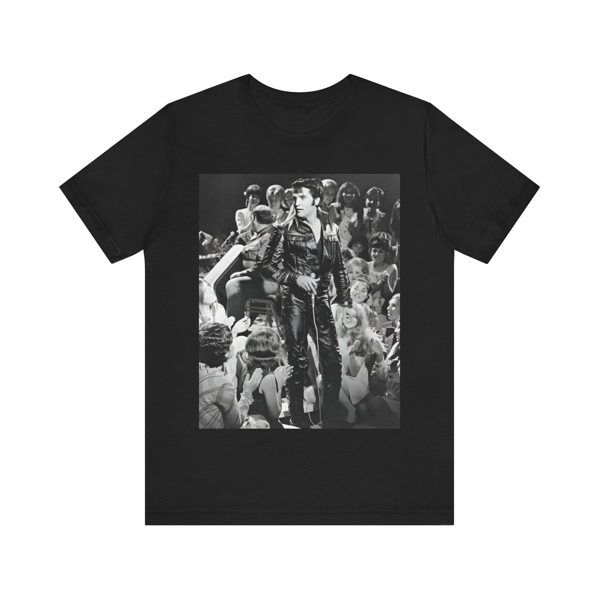 A black graphic t-shirt featuring a vintage black and white photo or graphic of Elvis Presley performing live on stage.