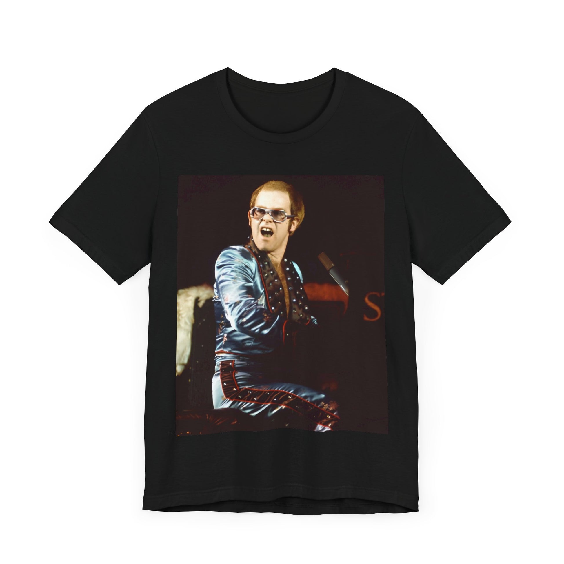 A black graphic t-shirt featuring a retro graphic related to Elton John's 'Rocket Man' song or era.