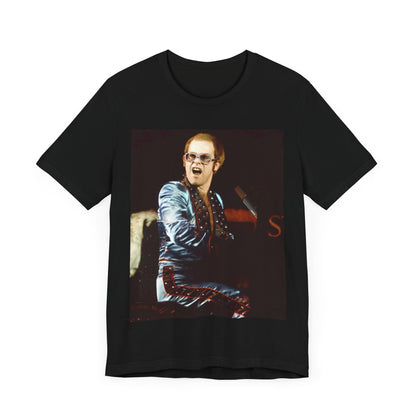 A black graphic t-shirt featuring a retro graphic related to Elton John's 'Rocket Man' song or era.