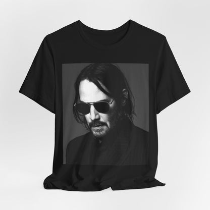 A black graphic t-shirt featuring a graphic of Keanu Reeves with a rebel spirit aesthetic.