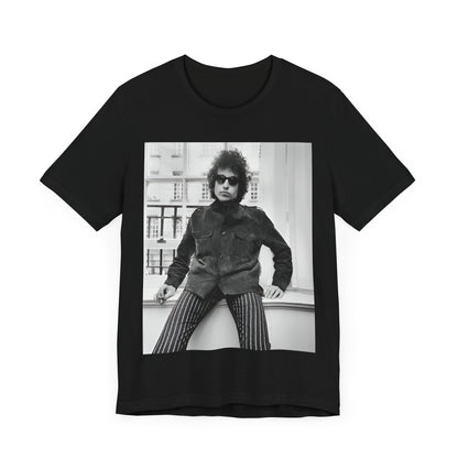 A black graphic t-shirt featuring a graphic related to Bob Dylan's 'Highway 61' era, possibly with album art elements or iconic imagery.