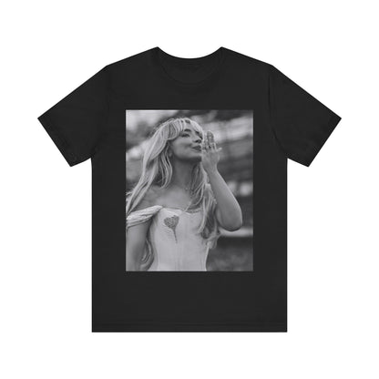 A black graphic t-shirt featuring a graphic or photo of Sabrina Carpenter kissing on stage during a performance.