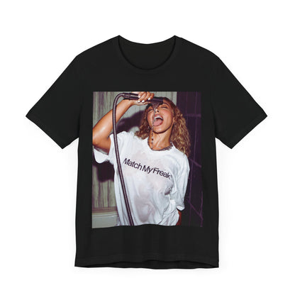 A black graphic t-shirt featuring an aesthetic graphic of Tinashe with a 'Nasty' vibe.