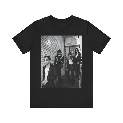 A black graphic t-shirt featuring a black and white graphic or photo of Maneskin in a backstage setting.