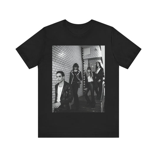 A black graphic t-shirt featuring a black and white graphic or photo of Maneskin in a backstage setting.