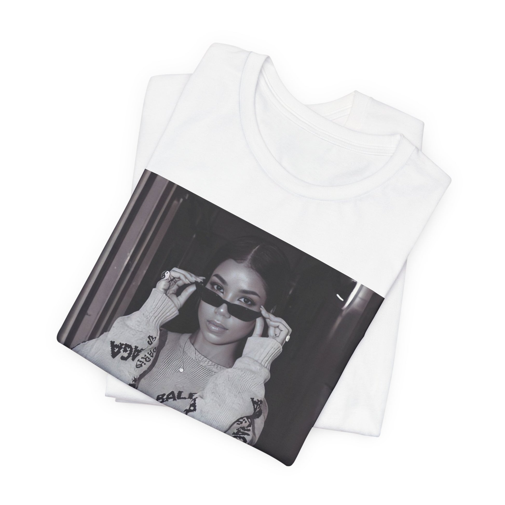 A black graphic t-shirt featuring a black and white, monochrome graphic or photo of Jhene Aiko.
