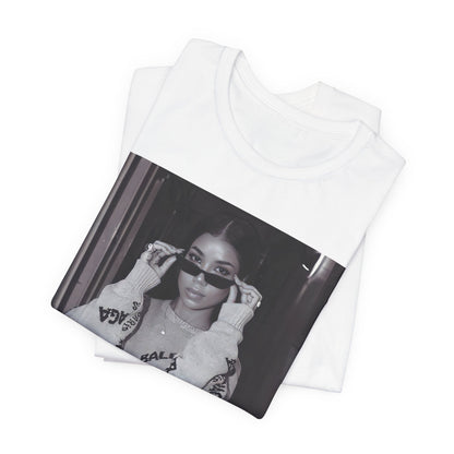 A black graphic t-shirt featuring a black and white, monochrome graphic or photo of Jhene Aiko.
