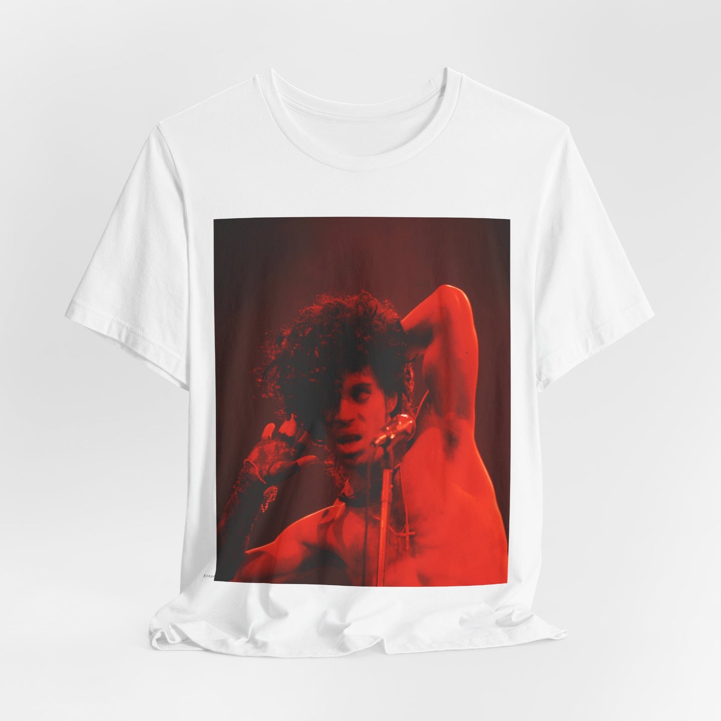 A black graphic t-shirt featuring a concert pop fan graphic of Prince.