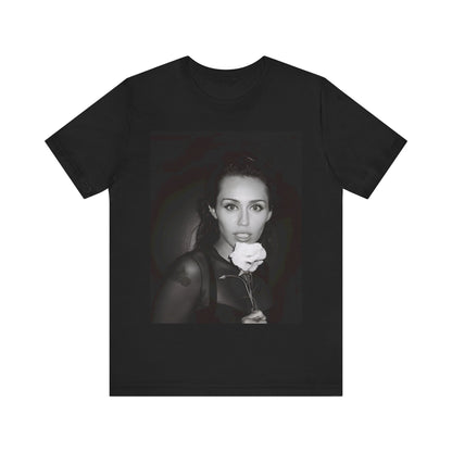 A black graphic t-shirt featuring a graphic related to Miley Cyrus' 'Flowers' song or era.