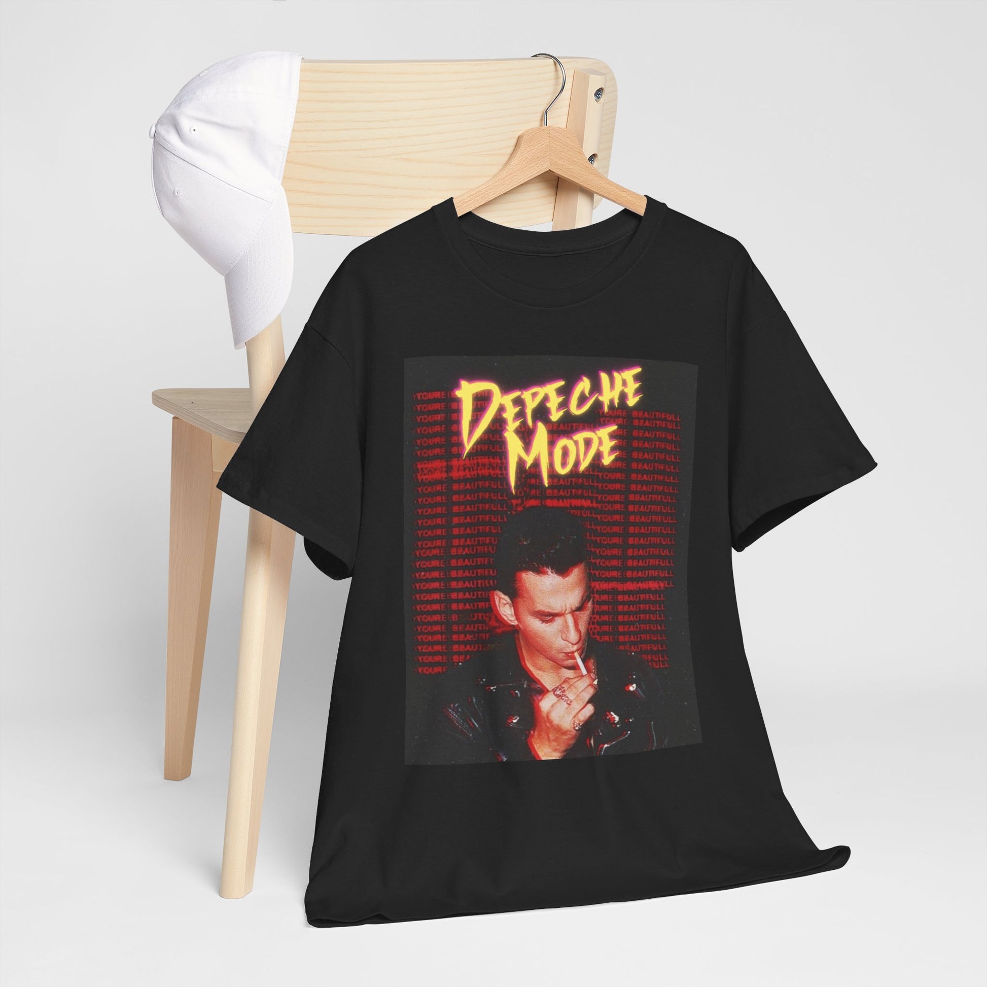 A black graphic t-shirt featuring a stylized graphic of Depeche Mode with an aesthetic design.