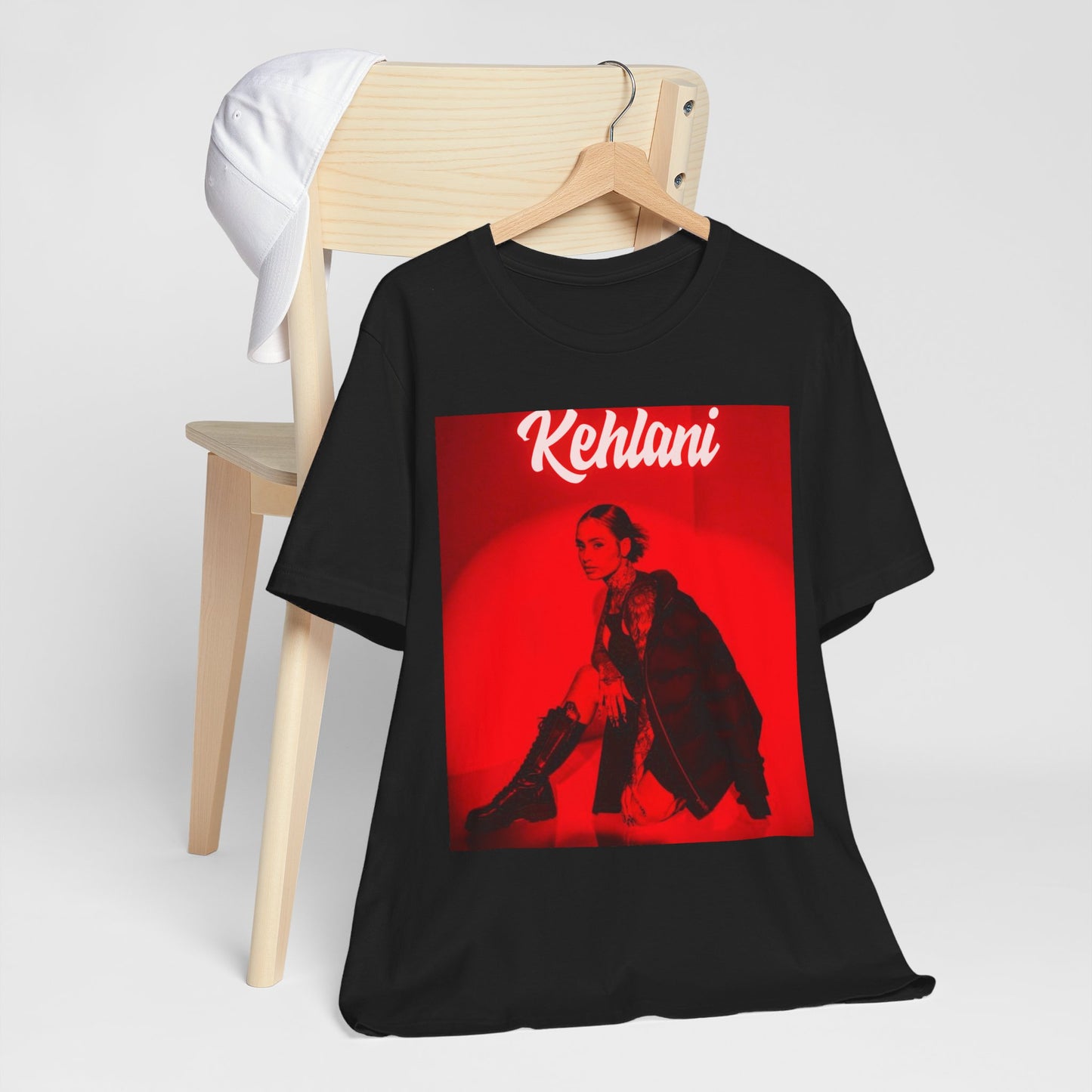 A black graphic t-shirt featuring a photo of Kehlani with a prominent red aesthetic or red lighting.