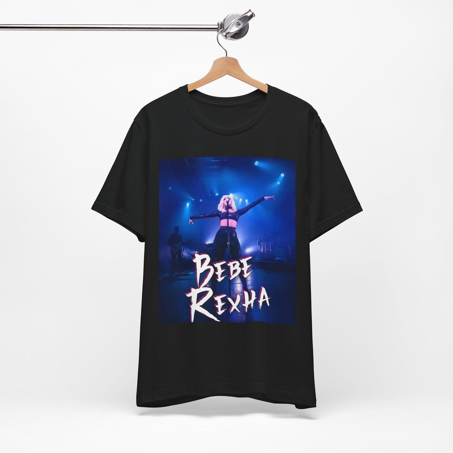 A black graphic t-shirt featuring a dynamic graphic or photo of Bebe Rexha performing live on stage.