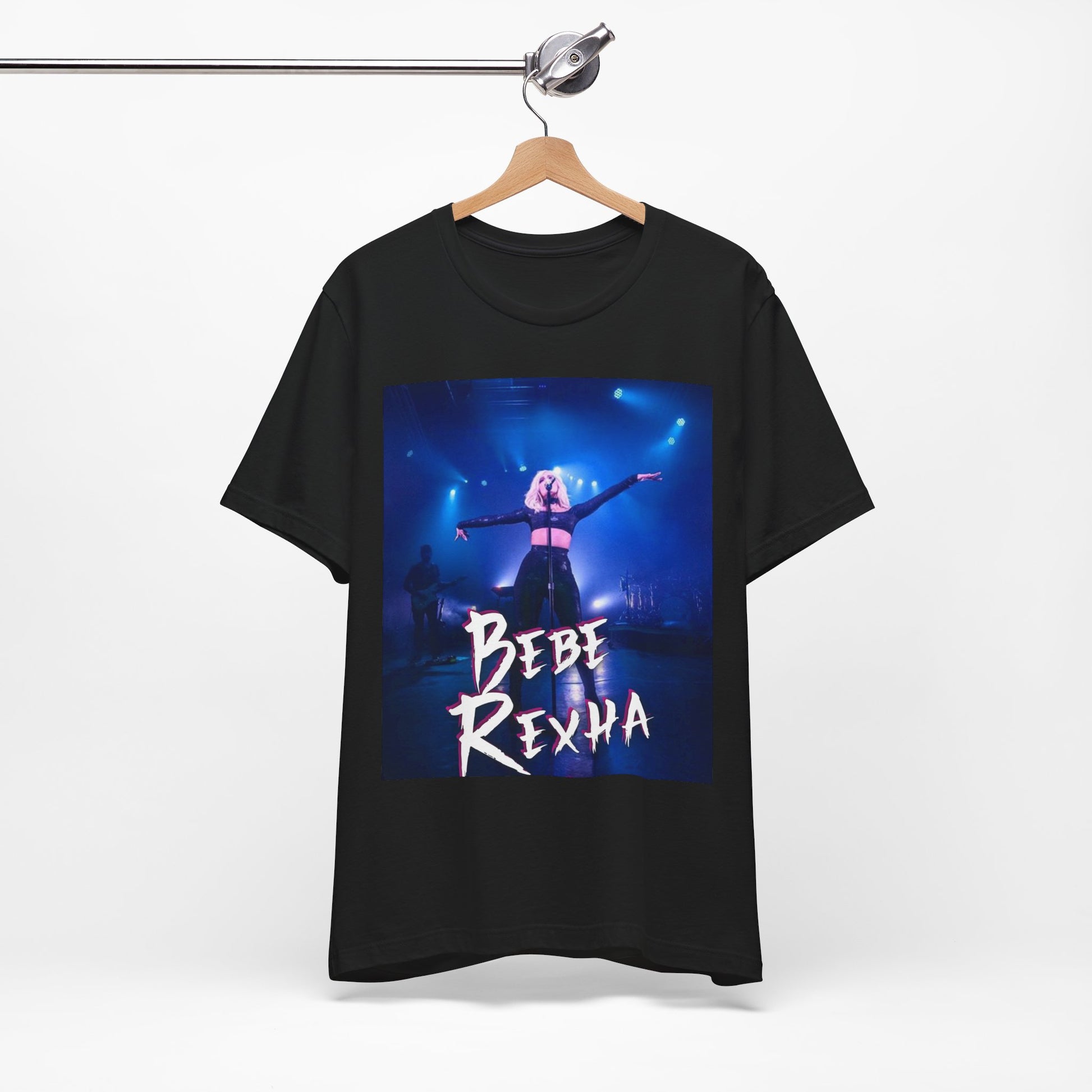 A black graphic t-shirt featuring a dynamic graphic or photo of Bebe Rexha performing live on stage.