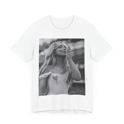 A black graphic t-shirt featuring a graphic or photo of Sabrina Carpenter kissing on stage during a performance.
