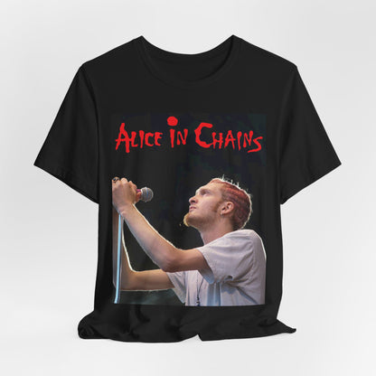 A black graphic t-shirt featuring the Alice In Chains logo in red, in a 90s grunge style.
