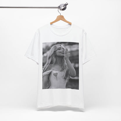 A black graphic t-shirt featuring a graphic or photo of Sabrina Carpenter kissing on stage during a performance.