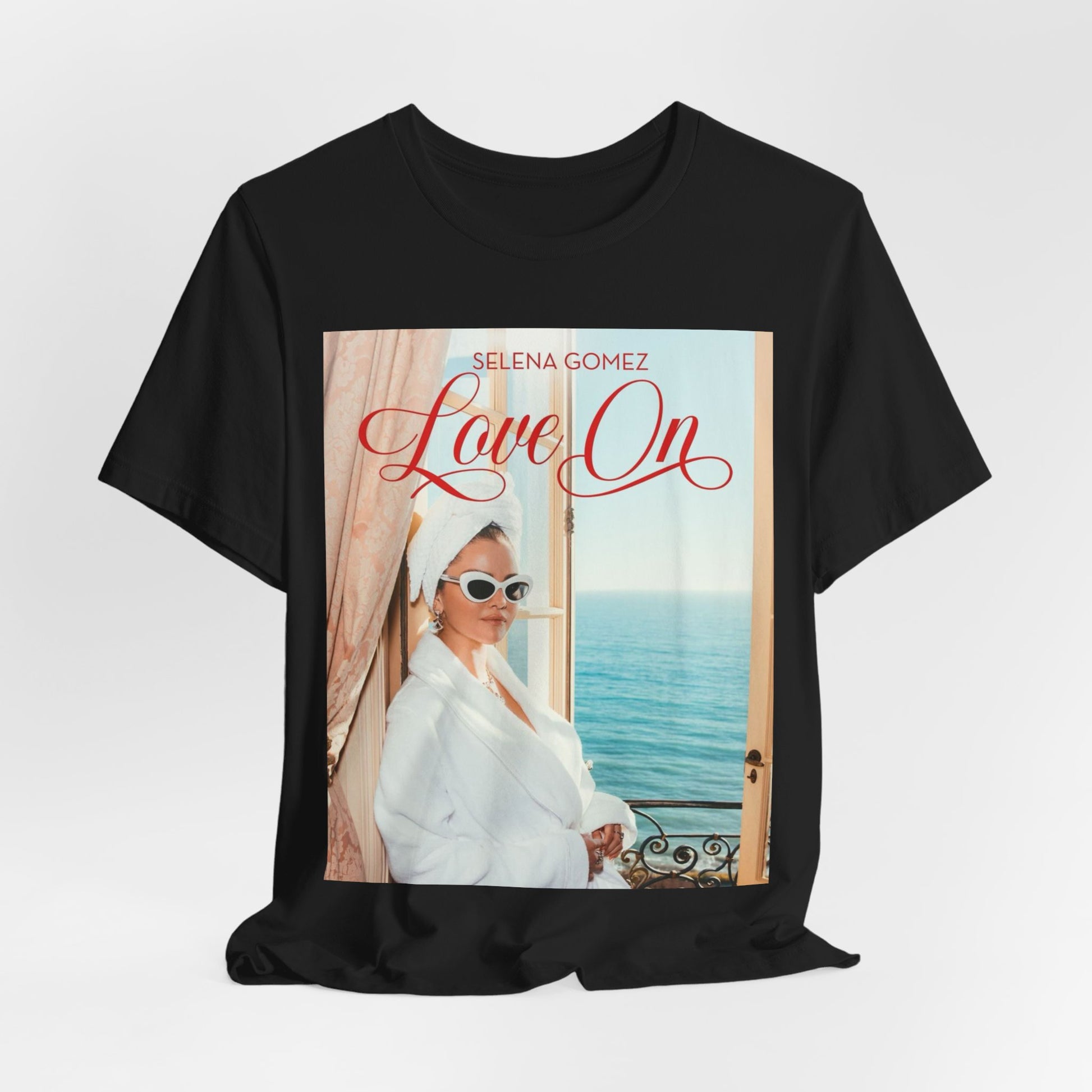 A black graphic t-shirt featuring a graphic related to Selena Gomez's 'Love On' song.