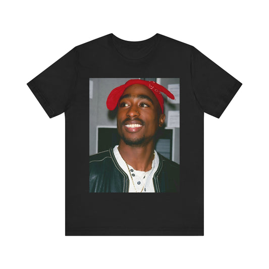 A black graphic t-shirt featuring a graphic of Tupac with his iconic bandana style.