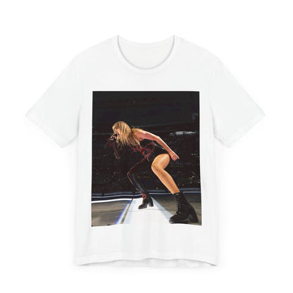 A black graphic t-shirt featuring a fierce graphic of Taylor Swift on stage.