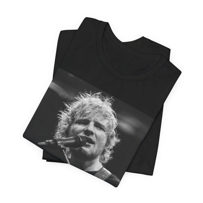 A black graphic t-shirt featuring a black and white photo of Ed Sheeran performing live.