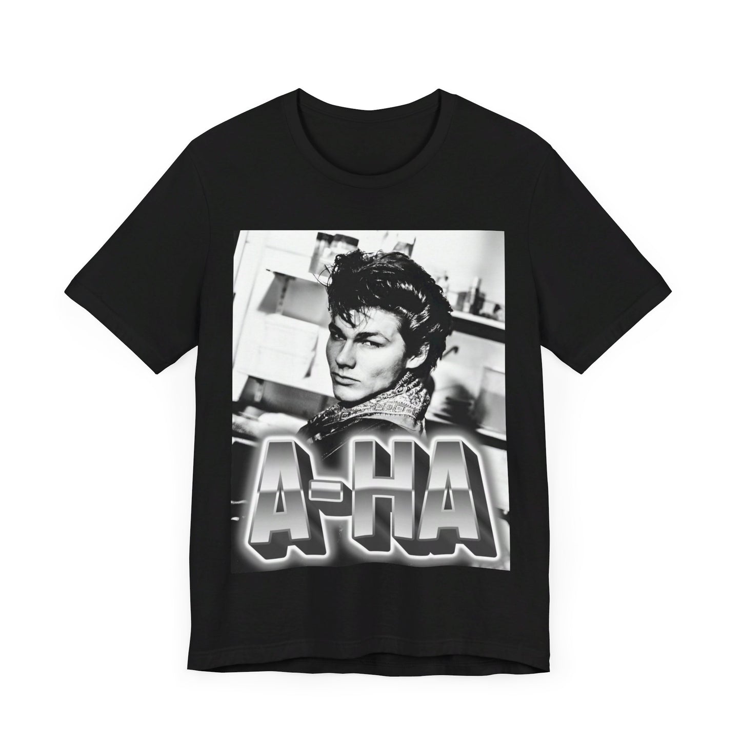 A black graphic t-shirt featuring a retro 1986-style graphic for the band A-HA, possibly with band members in a stylized design.