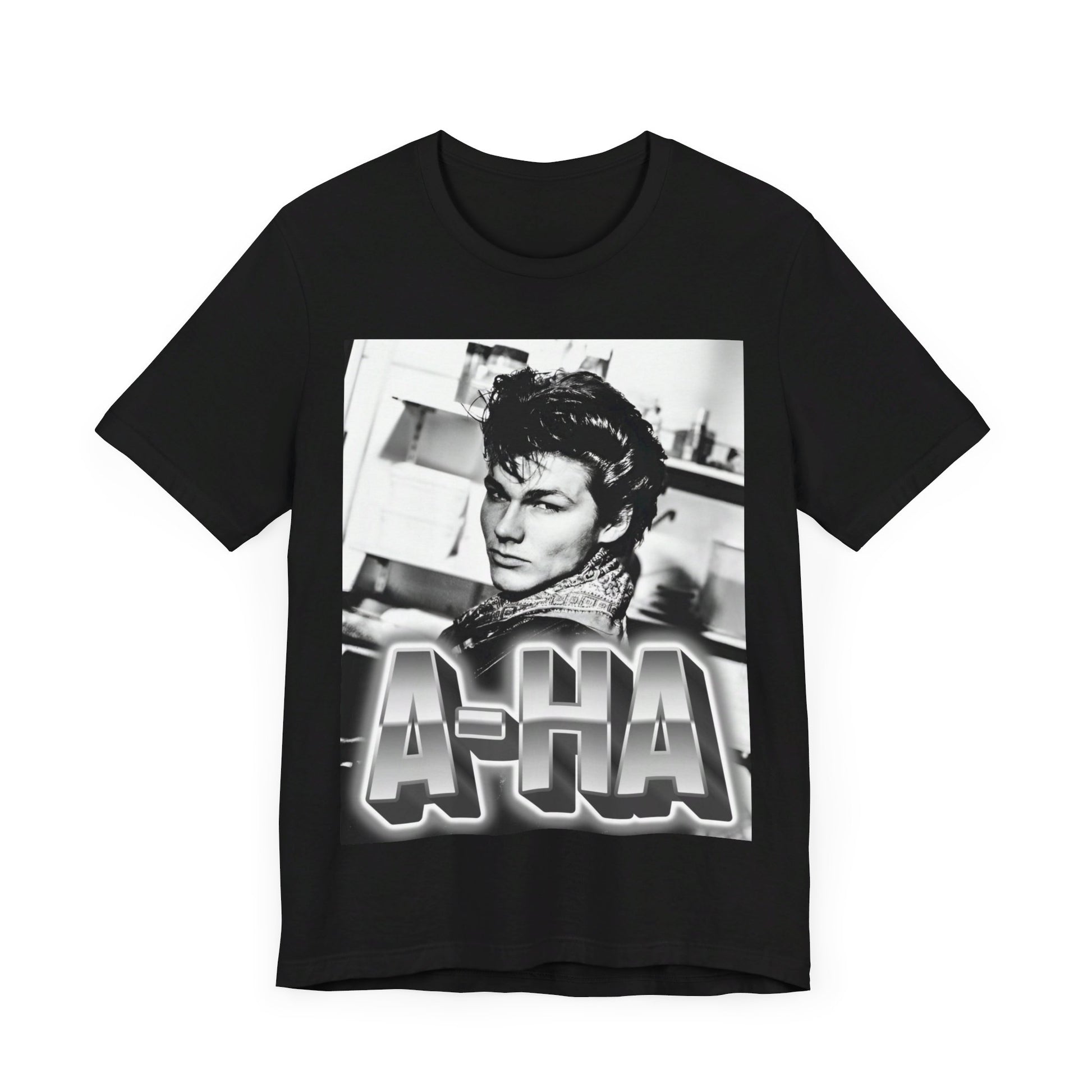 A black graphic t-shirt featuring a retro 1986-style graphic for the band A-HA, possibly with band members in a stylized design.