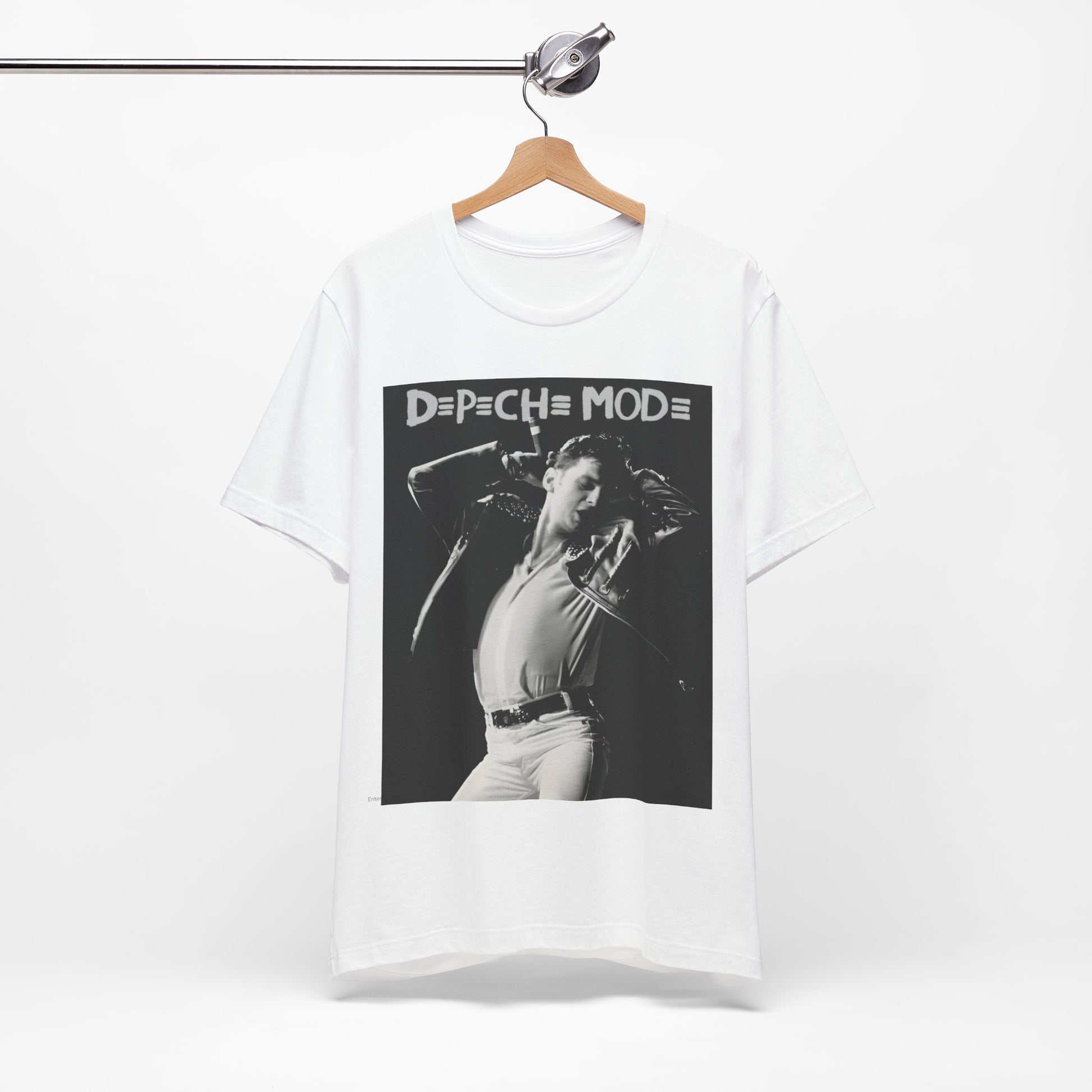 A black graphic t-shirt featuring a black and white graphic or photo of Depeche Mode performing live on stage.