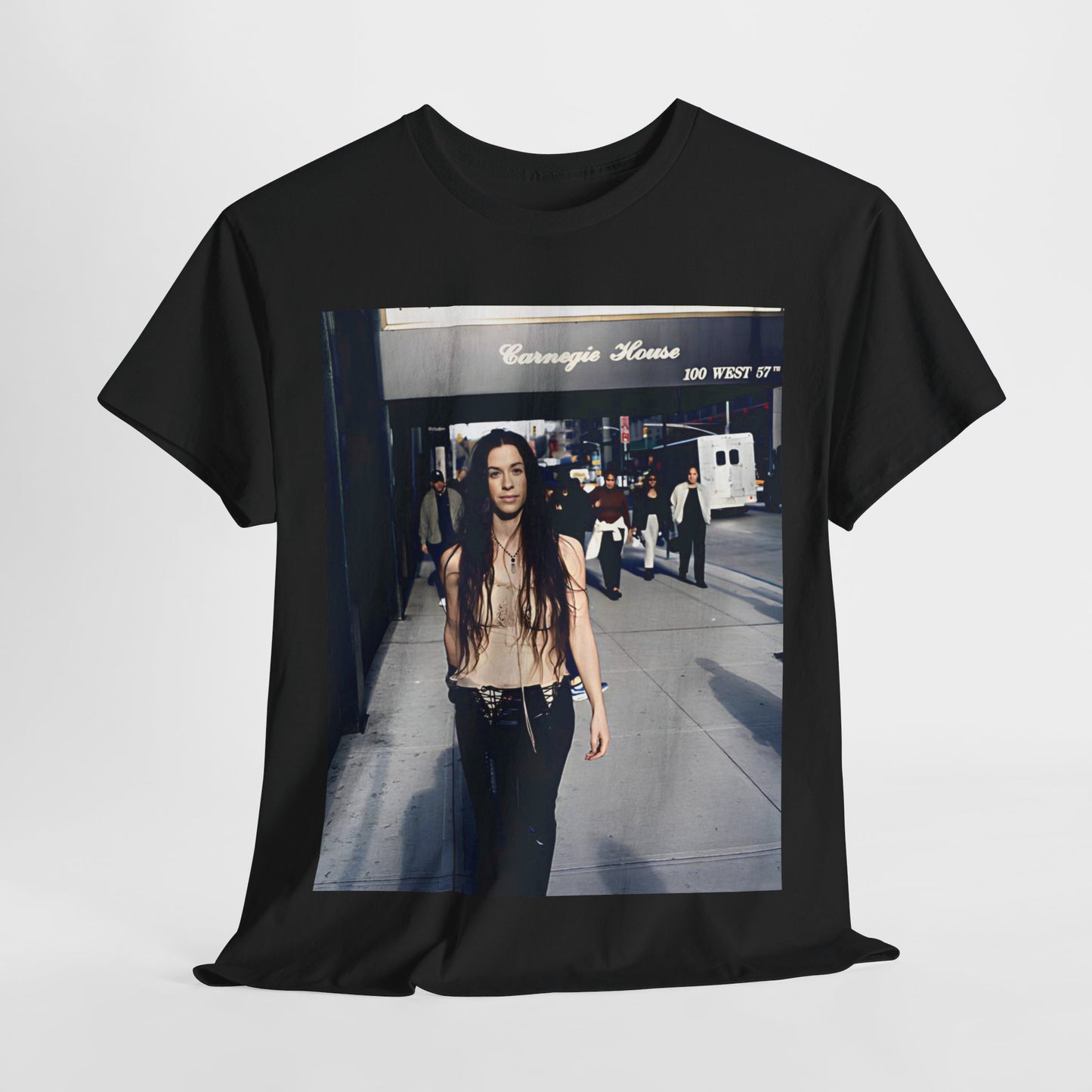 A black graphic t-shirt featuring a 90s-style graphic of Alanis Morissette with New York City elements or skyline in the background.