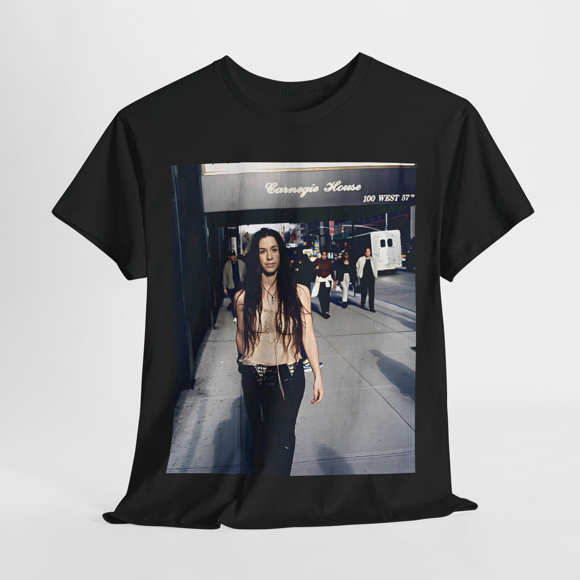 A black graphic t-shirt featuring a 90s-style graphic of Alanis Morissette with New York City elements or skyline in the background.