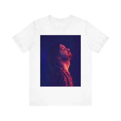 A black graphic t-shirt featuring a retro indie alt-rock graphic of Tame Impala.