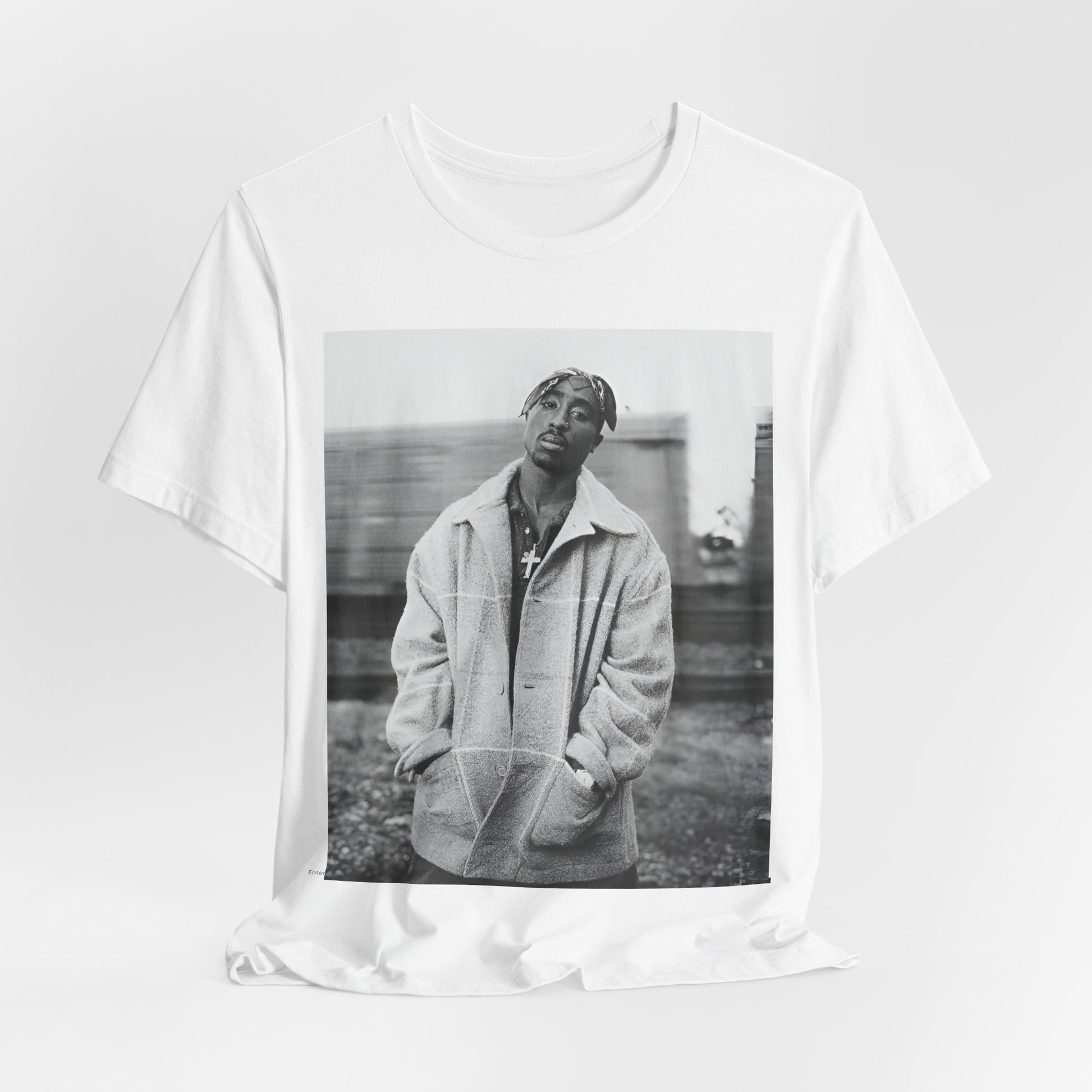 A black graphic t-shirt featuring a graphic related to Tupac's 'Thug Life' philosophy.