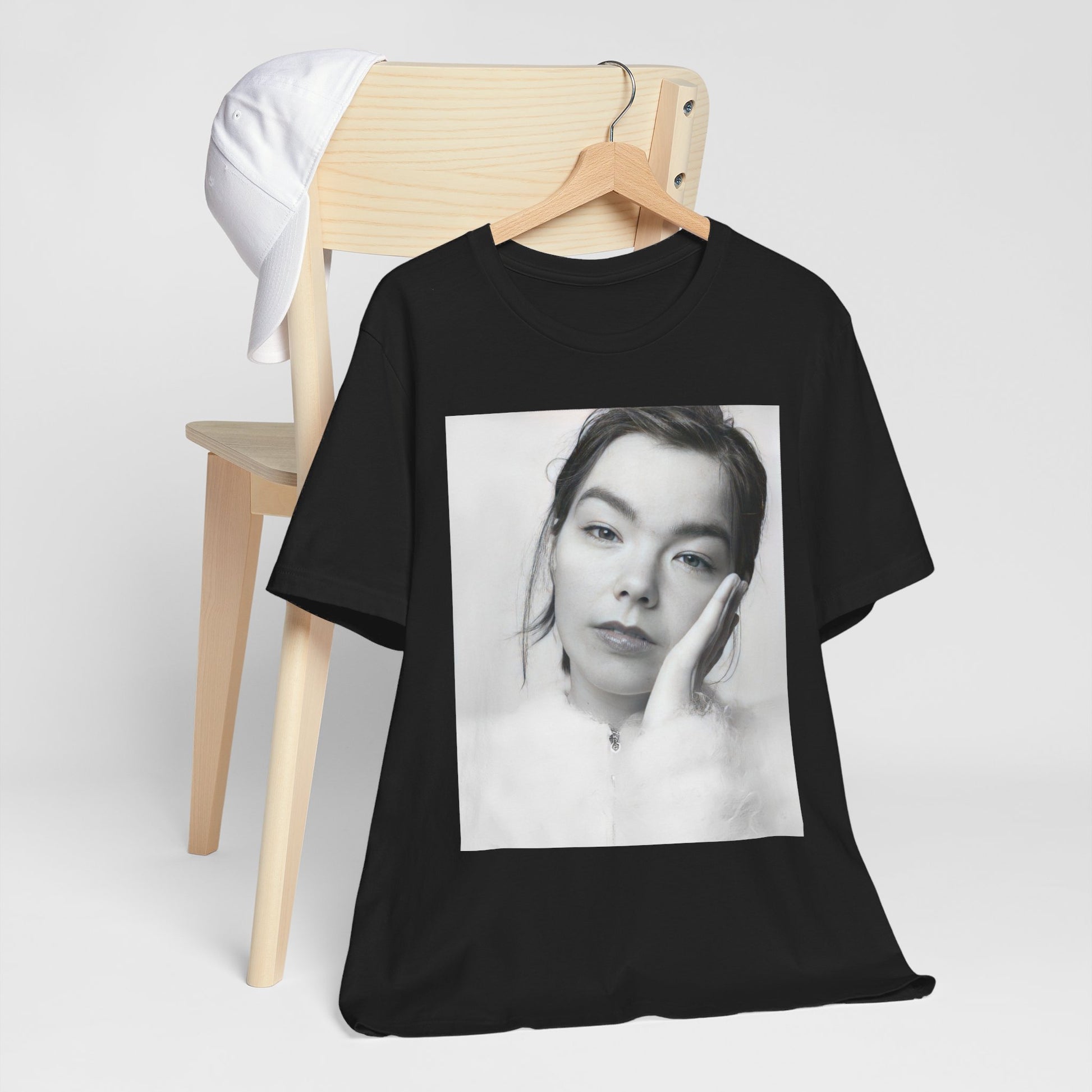A black graphic t-shirt featuring a graphic related to Bjork's 'Post' album era, possibly with album art elements.