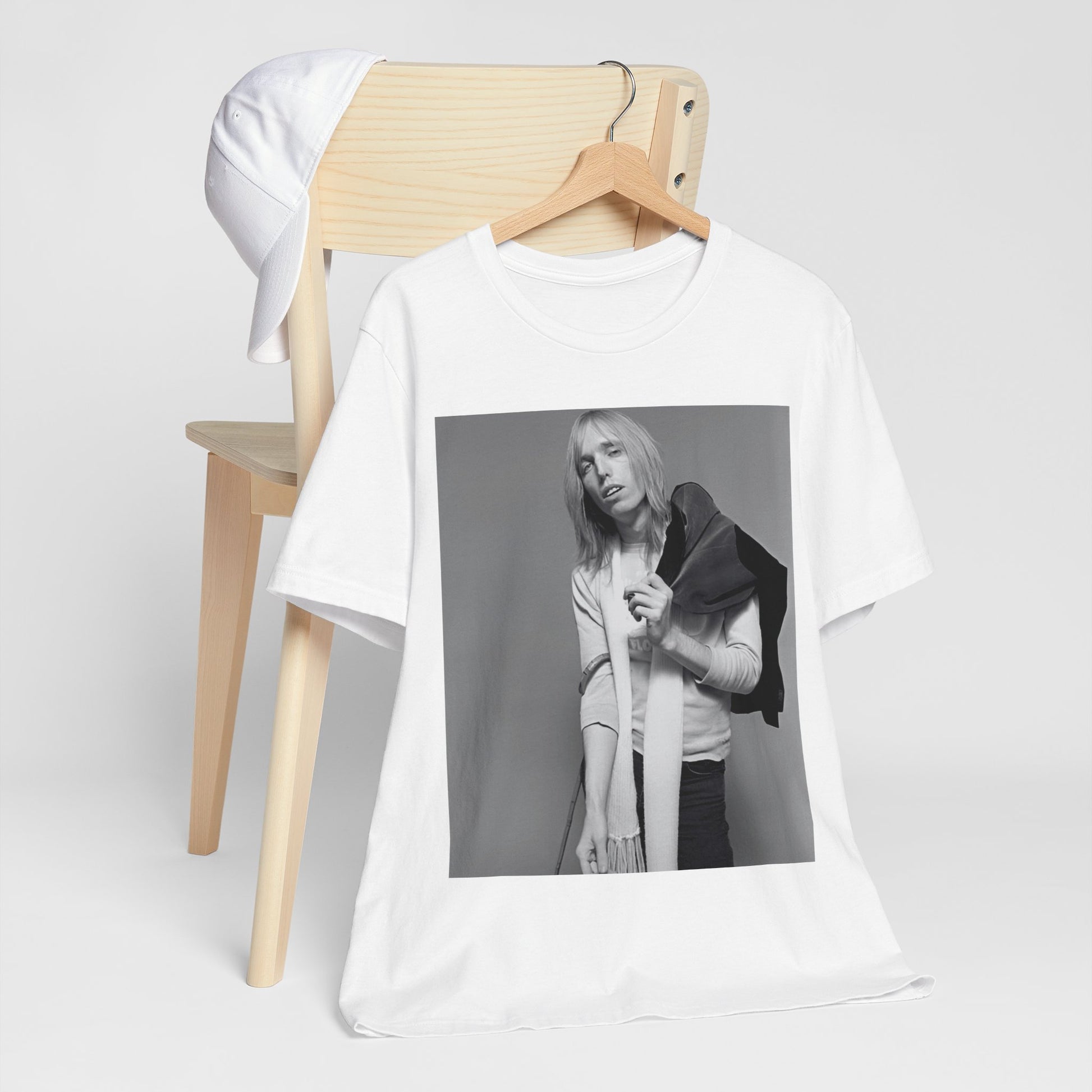 A black graphic t-shirt featuring a modern rock essential graphic of Tom Petty.