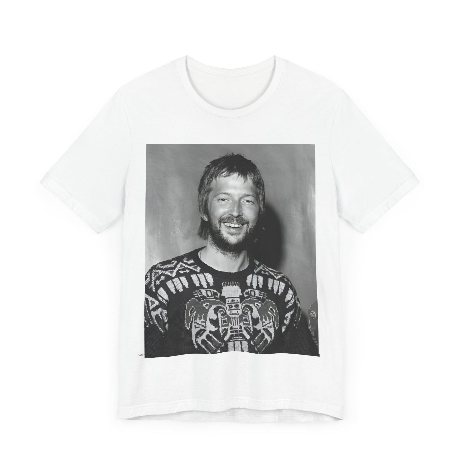 A black graphic t-shirt featuring a 70s photo portrait of Eric Clapton.