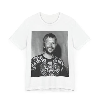 A black graphic t-shirt featuring a 70s photo portrait of Eric Clapton.