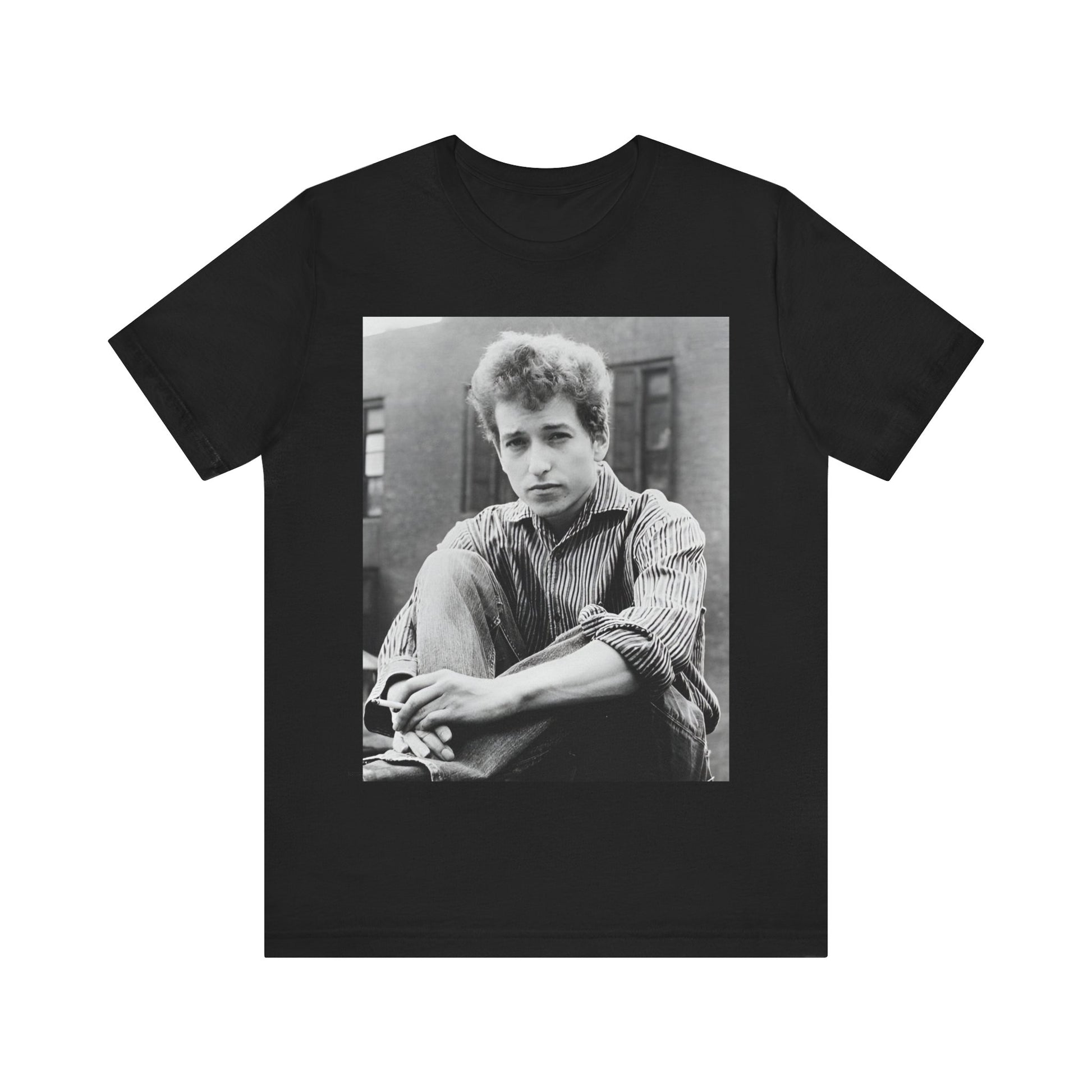A black graphic t-shirt featuring a graphic of Bob Dylan from his 60s origins in folk music.