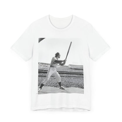 A black graphic t-shirt featuring a black and white graphic or photo related to Elton John's 1975 tour in America.