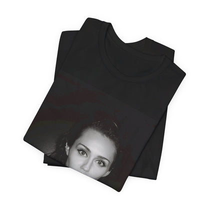 A black graphic t-shirt featuring a graphic related to Miley Cyrus' 'Flowers' song or era.