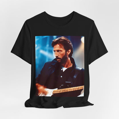 A black graphic t-shirt featuring a retro graphic or photo of Eric Clapton performing live on stage.