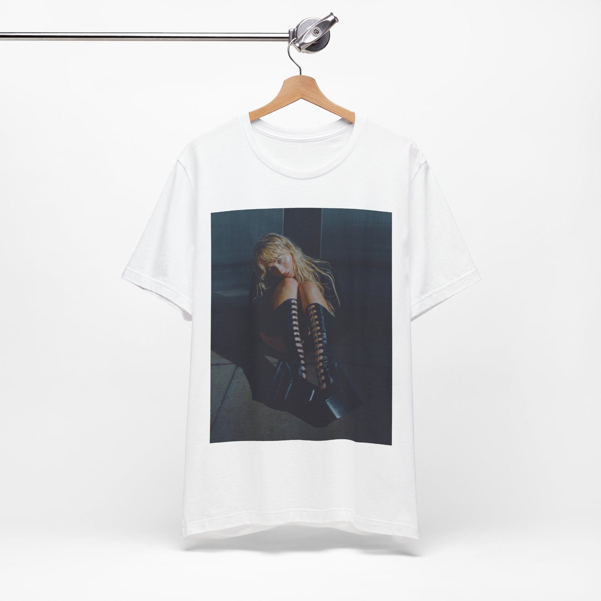 A black graphic t-shirt featuring a bold graphic of Sabrina Carpenter as a pop superstar.
