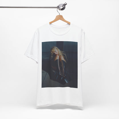 A black graphic t-shirt featuring a bold graphic of Sabrina Carpenter as a pop superstar.