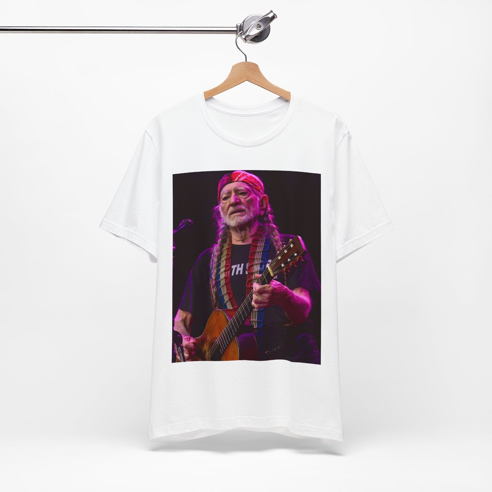 A black graphic t-shirt featuring an outlaw country legend graphic of Willie Nelson.