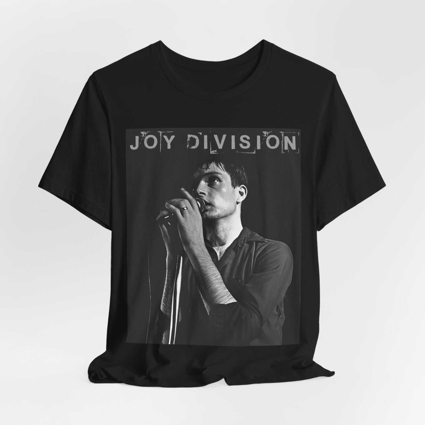 A black graphic t-shirt featuring an 80s goth rock aesthetic graphic of Joy Division.