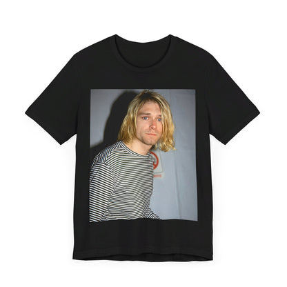 A black graphic t-shirt featuring a 90s photo portrait of Kurt Cobain from Nirvana.