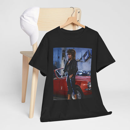A black graphic t-shirt featuring an 80s graphic of Tina Turner as a powerful rock woman.