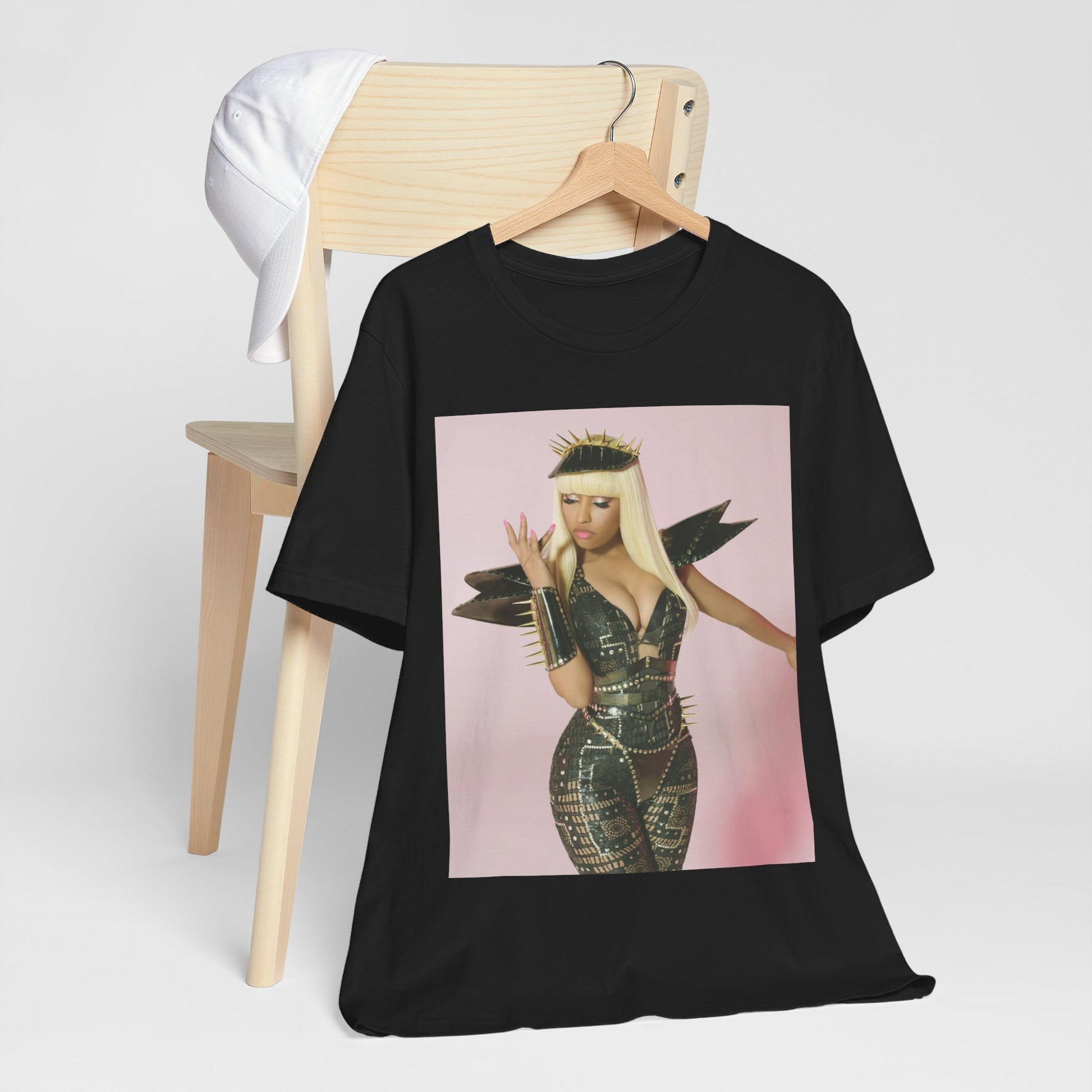 A black graphic t-shirt featuring a high fashion street vibe graphic of Nicki Minaj.