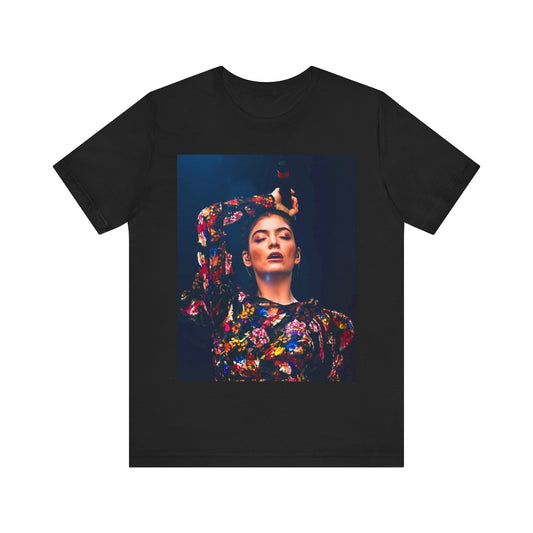A black graphic t-shirt featuring a retro graphic related to Lorde's 'Pure Heroine' album era.