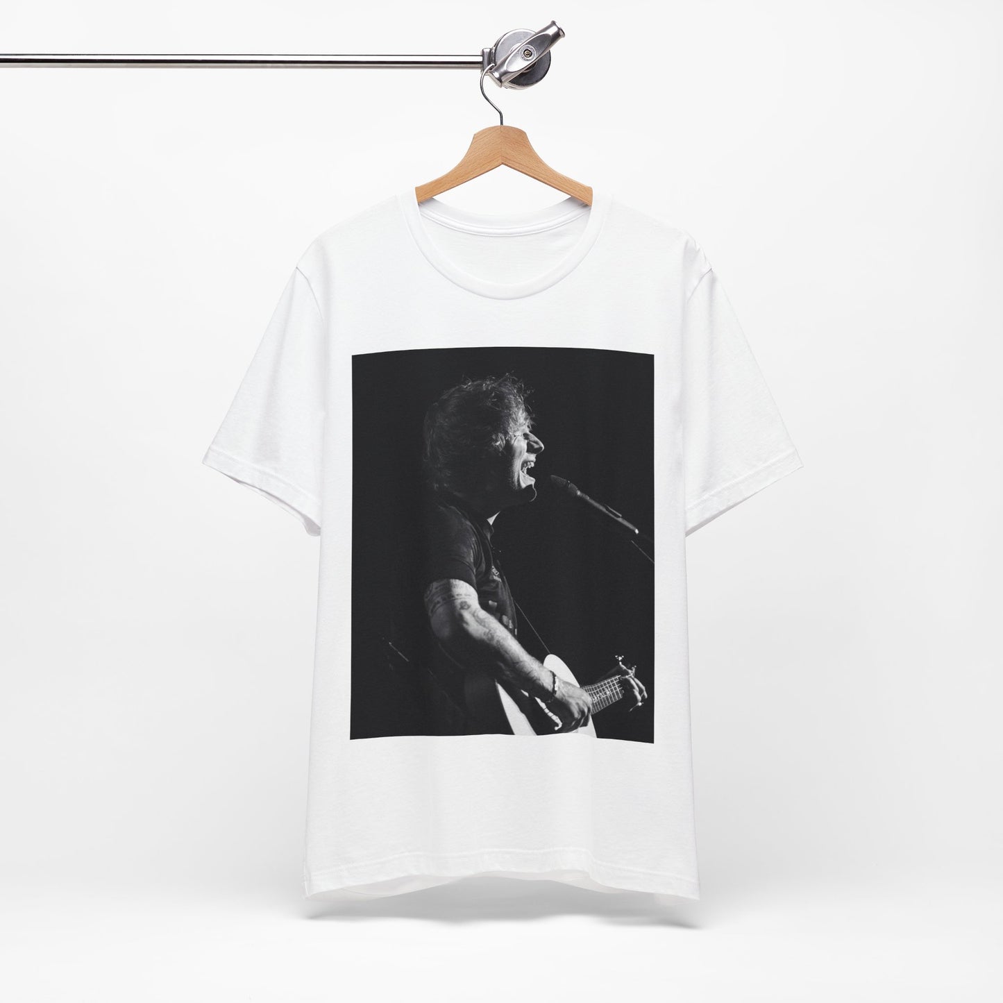 A black graphic t-shirt featuring a graphic related to Ed Sheeran's stadium tour.