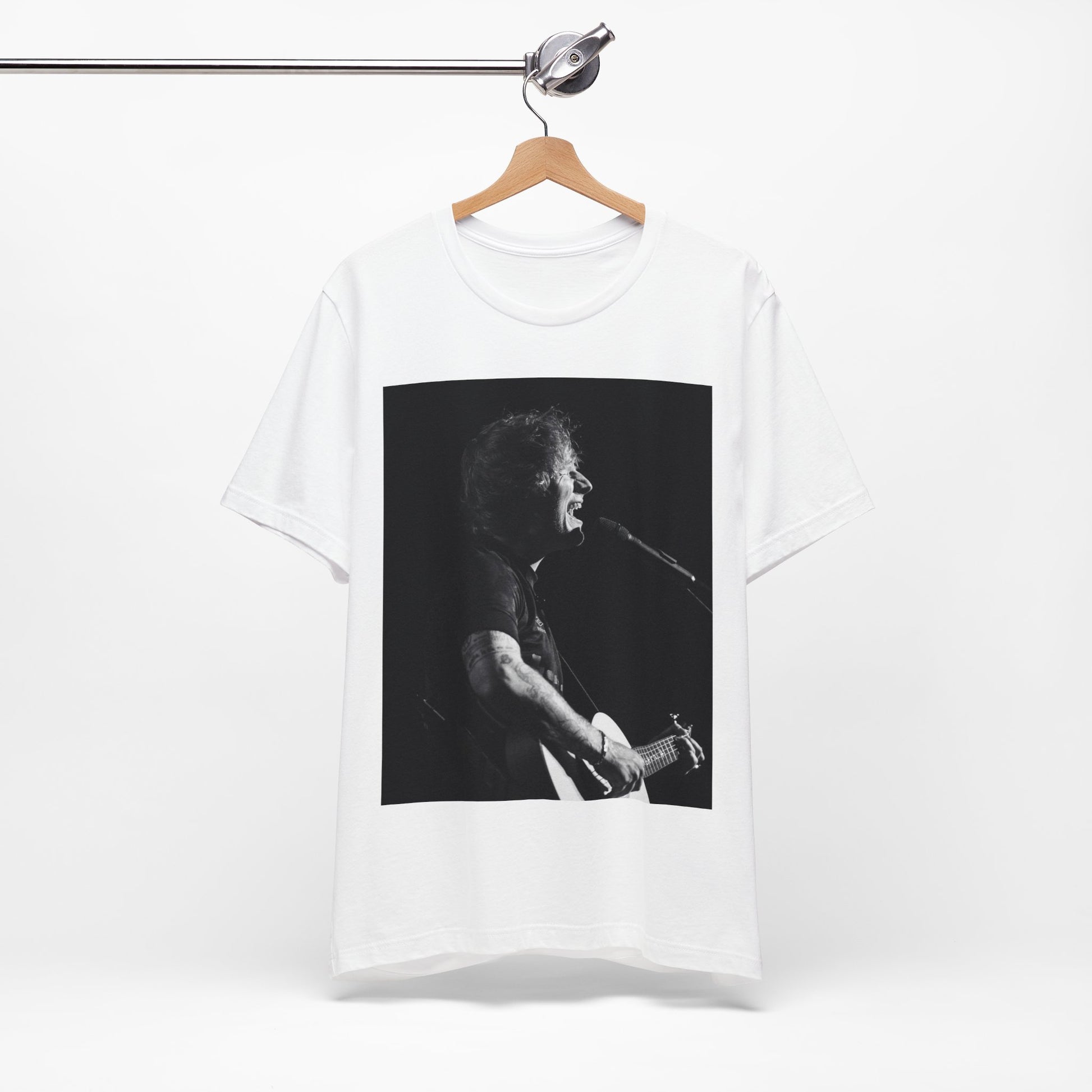 A black graphic t-shirt featuring a graphic related to Ed Sheeran's stadium tour.